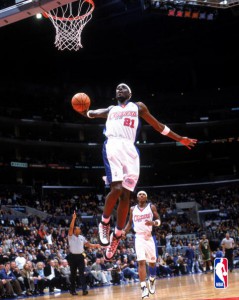 Darius Miles dunks the ball.