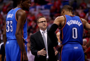 LOS ANGELES, CA - MAY 09: Head coach Scott Brooks of the Oklahoma City Thunder talks with Russell Westbrook #0 and Kevin Durant #35 against the Los Angeles Clippers in Game Three of the Western Conference Semifinals during the 2014 NBA Playoffs at Staples Center on May 9, 2014 in Los Angeles, California. The Thunder won 118-112. NOTE TO USER: User expressly acknowledges and agrees that, by downloading and or using this photograph, User is consenting to the terms and conditions of the Getty Images License Agreement. (Photo by Stephen Dunn/Getty Images)