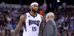 SACRAMENTO, CA - FEBRUARY 20:  DeMarcus Cousins #15 of the Sacramento Kings walks back to the bench past head coach George Karl after Cousins was called for a technical foul against the Boston Celtics in the first quarter at Sleep Train Arena on February 20, 2015 in Sacramento, California. NOTE TO USER: User expressly acknowledges and agrees that, by downloading and or using this photograph, User is consenting to the terms and conditions of the Getty Images License Agreement.  (Photo by Thearon W. Henderson/Getty Images)