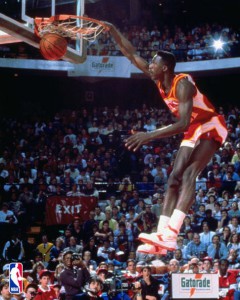 PLEASE NOTE THIS IMAGE IS FOR USE VIA THE CONSUMER POD SITE ONLY. CHICAGO - JANUARY 1:  Dominique Wilkins of the Atlanta Hawks dunks during the 1988 NBA All Star Slam Dunk Competion at Chicago Stadium on January 1, 1988 in Chicago, Illinios.  NOTE TO USER: User expressly acknowledges and agrees that, by downloading and or using this photograph, User is consenting to the terms and conditions of the Getty Images License Agreement. Mandatory copyright notice: Copyright NBAE 1988  (Photo by Nathaniel S. Butler/NBAE/Getty Images)