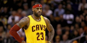 Cleveland Cavaliers' LeBron James watches against the Phoenix Suns during the first half of an NBA basketball game, Tuesday, Jan. 13, 2015, in Phoenix. (AP Photo/Matt York)