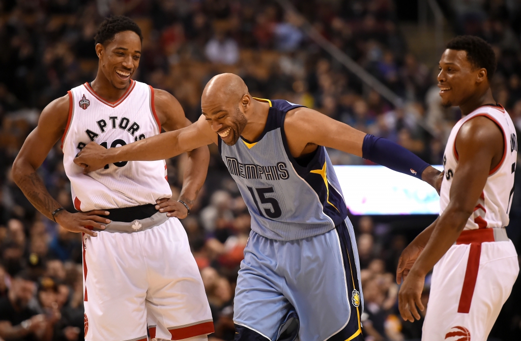 Feb 21, 2016; Toronto, Ontario, CAN; Memphis Grizzlies guard Vince Carter (15) jokes with Toronto Raptors guards DeMar DeRozan (10) and Kyle Lowry (7) during the first quarter at Air Canada Centre. Mandatory Credit: Dan Hamilton-USA TODAY Sports