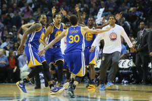 November 17, 2015; Oakland, CA, USA; Golden State Warriors interim head coach Luke Walton (far right) stands with his team during the fourth quarter against the Toronto Raptors at Oracle Arena. The Warriors defeated the Raptors 115-110. Mandatory Credit: Kyle Terada-USA TODAY Sports